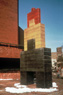Major, ©1982<br>Commission for Berger Associates for Postal Workers' House. The work, sited on a plaza in front of the building, refers to both stacked, toy-like figures, and to the three storied row houses common to Philadelphia. The largest of the three forms straddles a space to form a kind of triumphal arch only high enough for children to pass through. <br>
Pigmented concrete, 23'h x 10'w x 3'd <br>
Eight and Locust Streets, Philadelphia, Pennsylvania