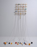 Quibble, ©2009<br>Brass, stainless steel, lead, wood, epoxy and pigments. <br>
(grid) 28.5h x 30.5w x 6d, (cable & balls) 84h x 72w x 60d (inches), dimensions variable <br>
Estate of Charles Fahlen <br>
Photo by Kelly McManus <br>
Exhibited: Quicksilver Mine Co.,2012